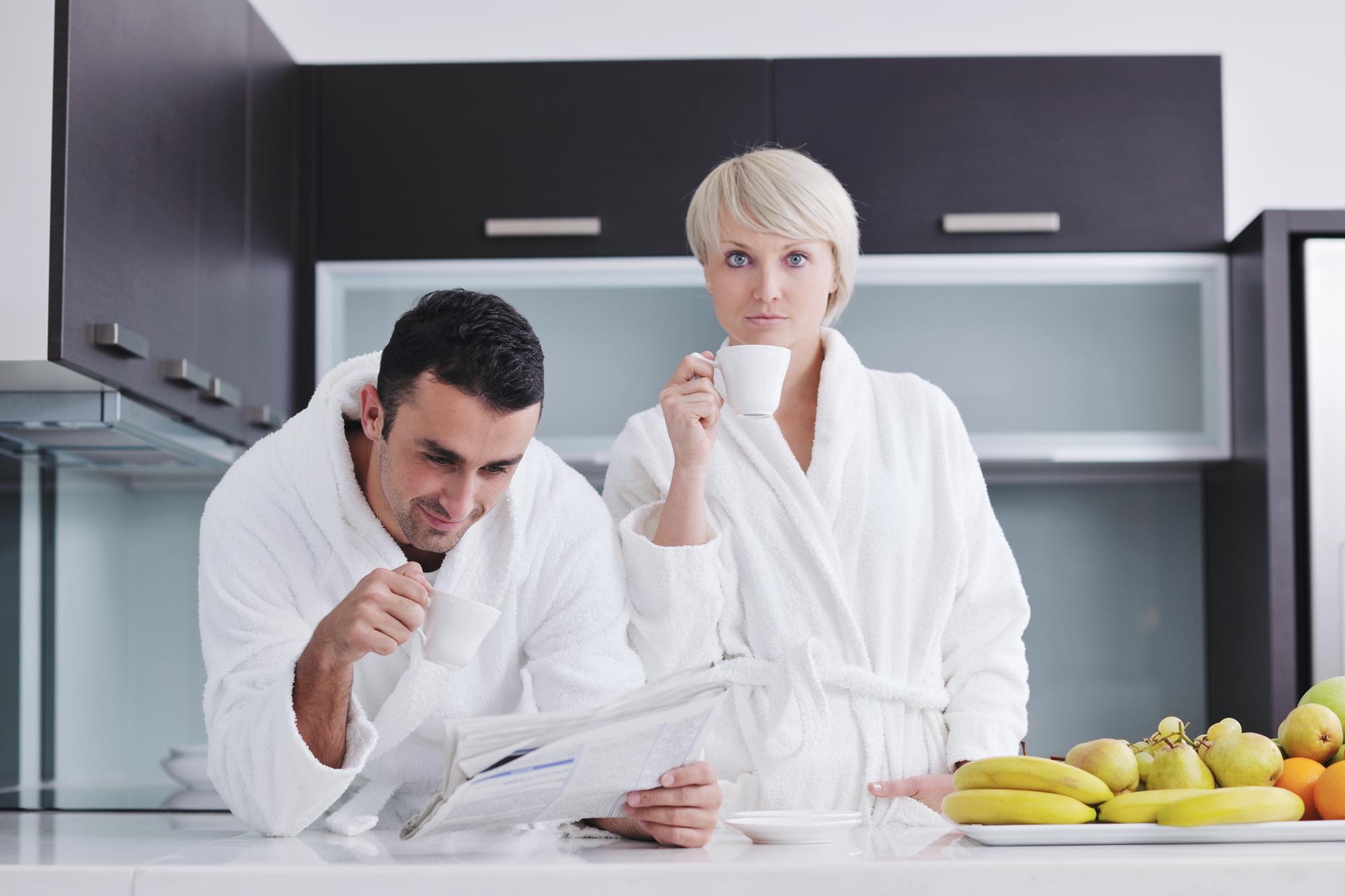 Chef speaking to client in modern kitchen
